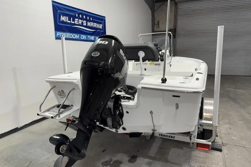 Slide: The Image of 2026 Sea Pro 172 Bay boat with Suzuki outboard motor in showroom. - 3