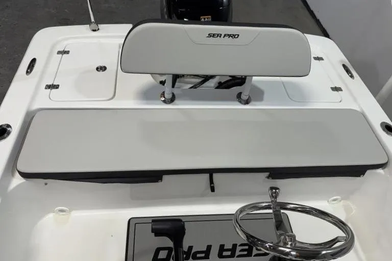 Slide: The Image of 2026 Sea Pro 172 Bay boat interior with steering wheel and seating. - 5