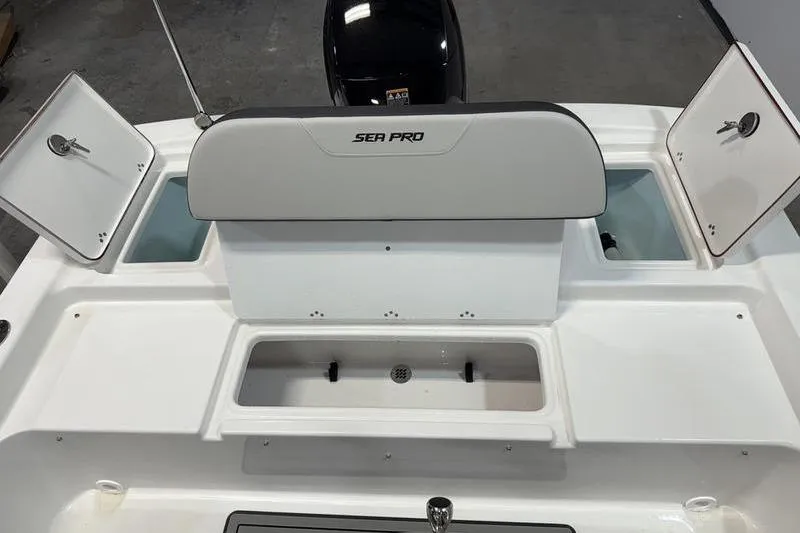 Slide: The Image of 2026 Sea Pro 172 Bay boat interior with storage compartments open. - 6