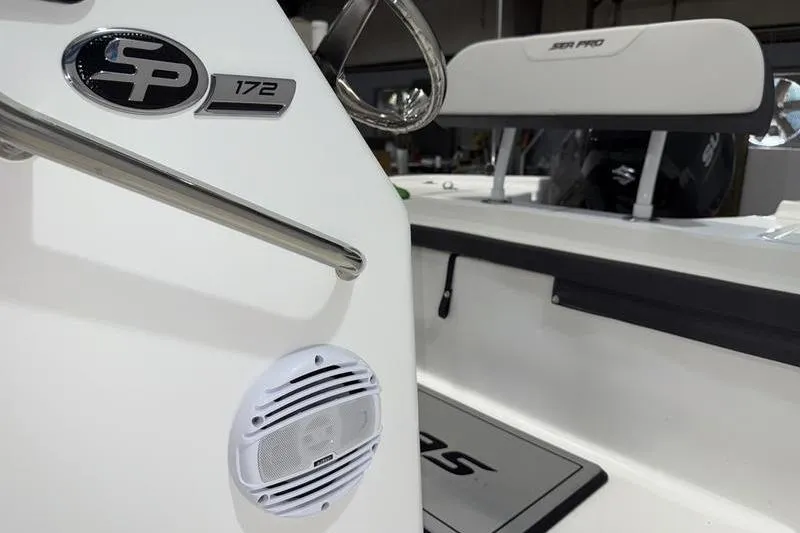 Slide: The Image of 2026 Sea Pro 172 Bay boat interior with steering wheel and speaker detail. - 7