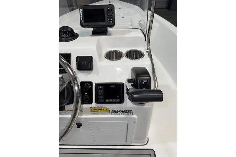 Slide: The Image of 2026 Sea Pro 172 Bay boat console with steering wheel, controls, and navigation display. - 9