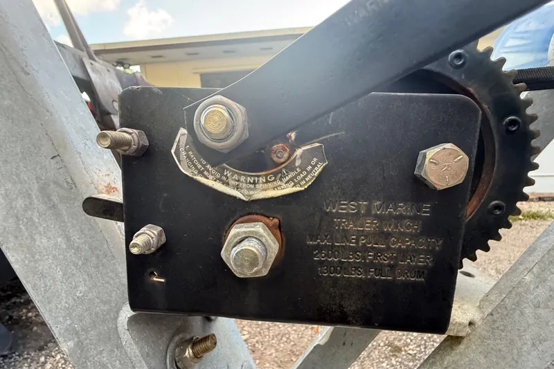 Slide: The Image of West Marine trailer winch on a 2004 Wellcraft 32 CCF boat trailer. - 25