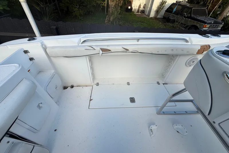 Slide: The Image of 2004 Wellcraft 32 CCF boat interior showing seating and storage compartments. - 40