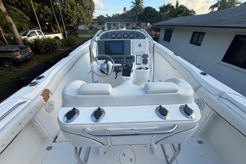 Slide: The Image of 2004 Wellcraft 32 CCF boat cockpit with steering wheel and control panel. - 42