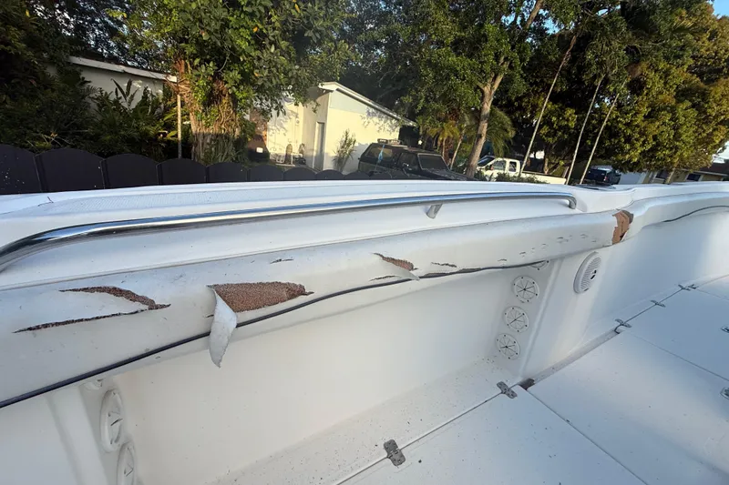 Slide: The Image of Damaged interior of 2004 Wellcraft 32 CCF boat with visible wear and tear. - 44