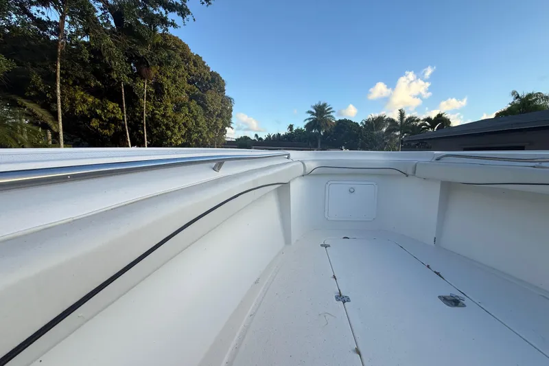 Slide: The Image of 2004 Wellcraft 32 CCF boat deck with trees and blue sky background. - 47
