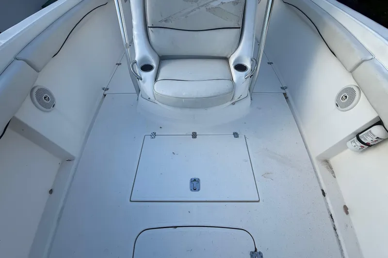 Slide: The Image of 2004 Wellcraft 32 CCF boat interior with seating and storage compartments. - 52