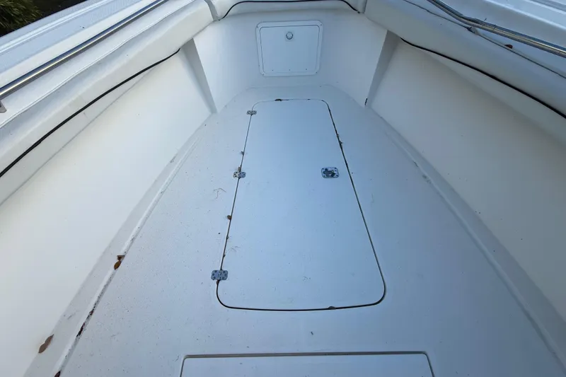 Slide: The Image of 2004 Wellcraft 32 CCF boat interior, featuring a clean, spacious deck area. - 55