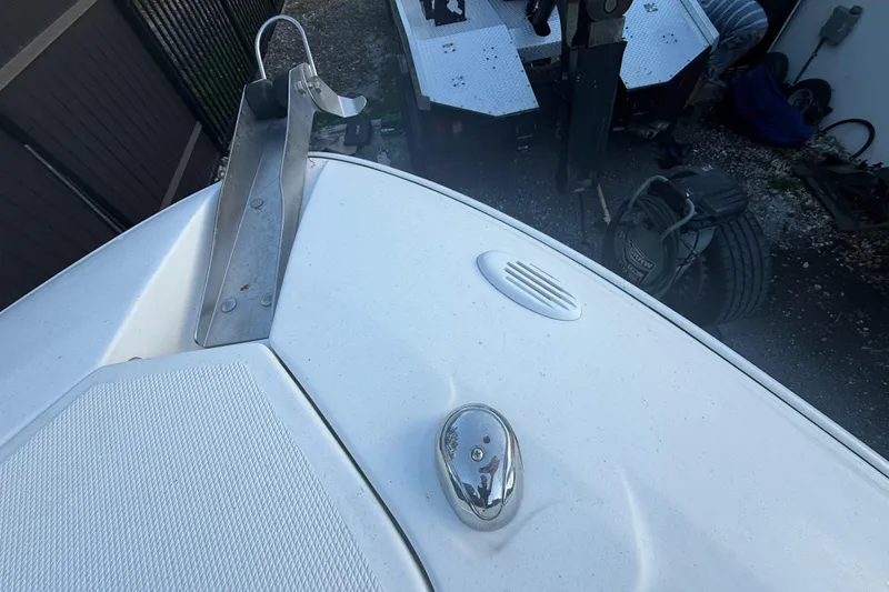 Slide: The Image of Bow of a 2004 Wellcraft 32 CCF boat with anchor holder and chrome fixture. - 61