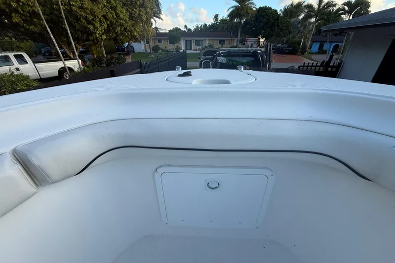 Slide: The Image of 2004 Wellcraft 32 CCF boat interior with seating and storage compartment. - 62