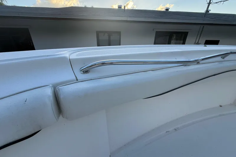 Slide: The Image of 2004 Wellcraft 32 CCF boat interior with cushioned seating and stainless steel railing. - 63