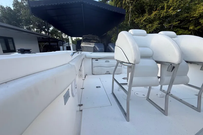 Slide: The Image of 2004 Wellcraft 32 CCF boat interior with white seating and spacious deck. - 70