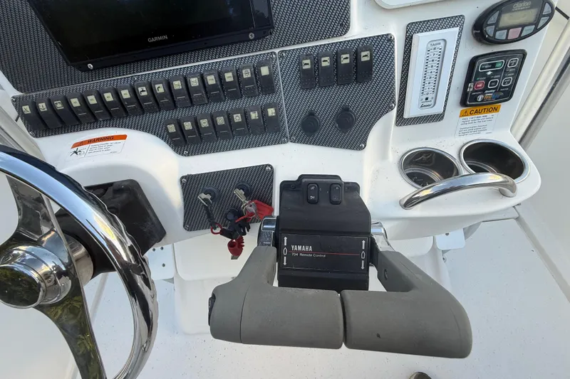 Slide: The Image of Control panel of 2004 Wellcraft 32 CCF boat with Yamaha remote and Garmin display. - 72