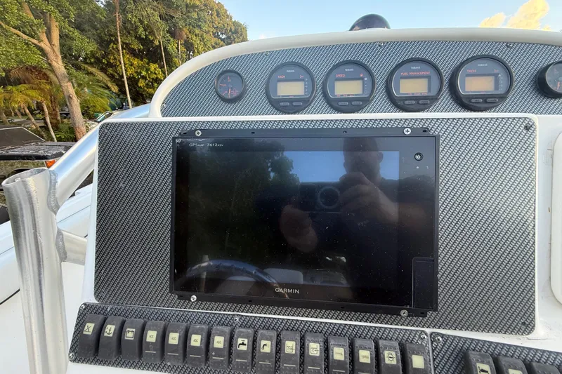 Slide: The Image of Dashboard of a 2004 Wellcraft 32 CCF boat with Garmin GPS and gauges. - 73