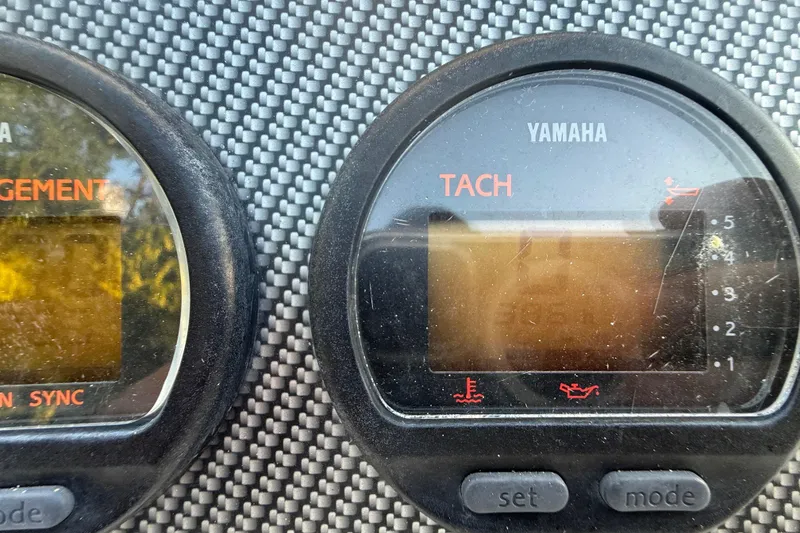 Slide: The Image of Yamaha tachometer on 2004 Wellcraft 32 CCF boat dashboard, close-up view. - 81