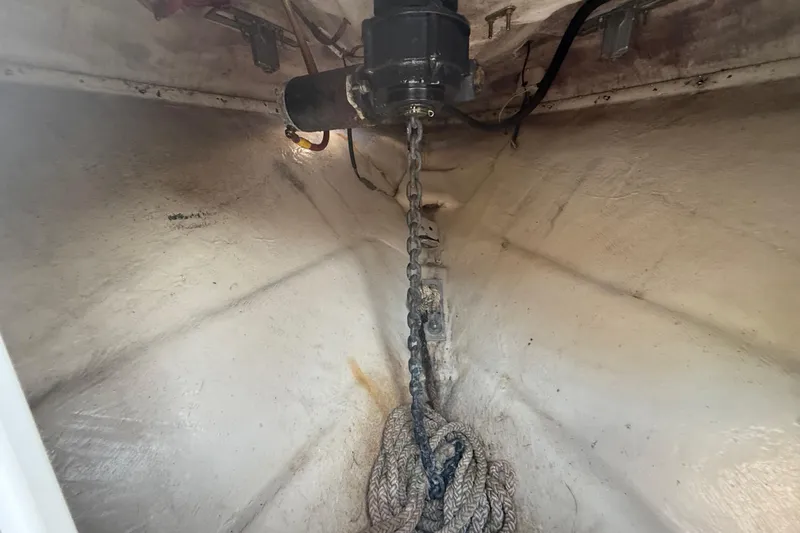 Slide: The Image of Anchor chain and rope in the bow of a 2004 Wellcraft 32 CCF boat. - 82