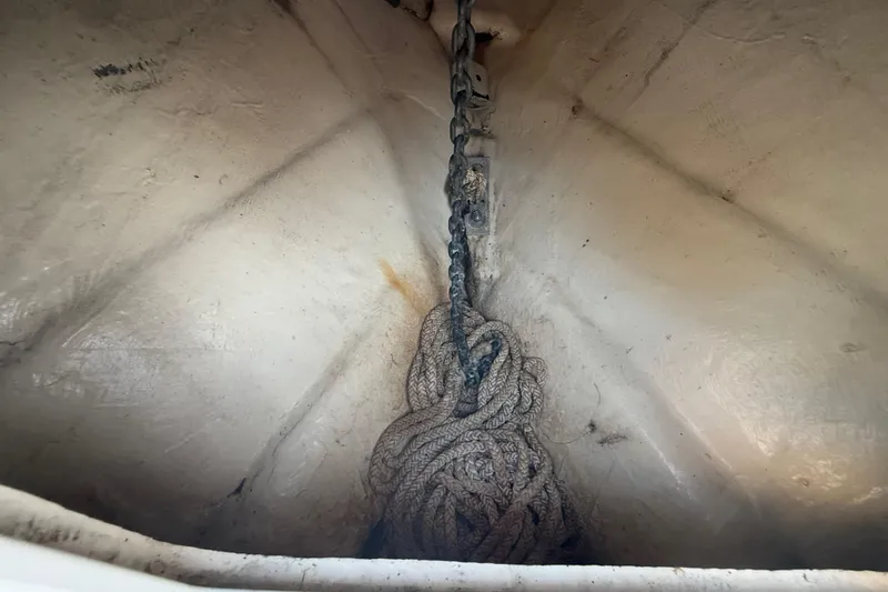 Slide: The Image of Anchor chain and rope in the bow of a 2004 Wellcraft 32 CCF boat. - 83