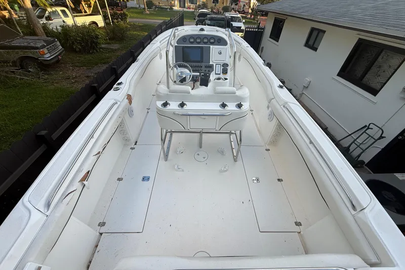 Slide: The Image of 2004 Wellcraft 32 CCF boat interior with steering console and seating. - 89