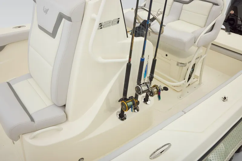 Slide: The Image of 2026 Mako 226 Center Console boat interior with white seating in a parking lot. - 11