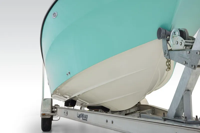 Slide: The Image of 2026 Mako 226 Center Console boat with Mercury outboard engine, parked outdoors. - 4