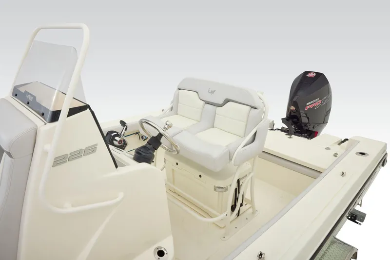 Slide: The Image of 2026 Mako 226 Center Console boat in empty parking lot, showcasing seating area. - 7