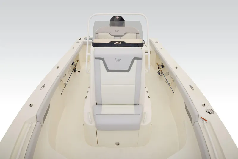 Slide: The Image of 2026 Mako 226 Center Console boat interior with storage compartment, parked in a lot. - 8