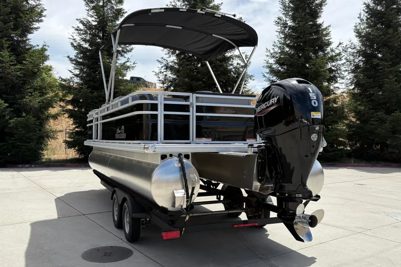 Slide: The Image of 2026 Sun Tracker SportFish 22 DLX pontoon boat with Mercury 150 engine on trailer. - 8