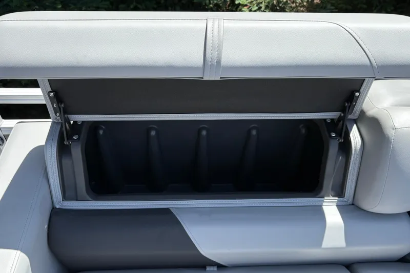 Slide: The Image of Open storage compartment in 2026 Sun Tracker SportFish 22 DLX boat seat. - 22