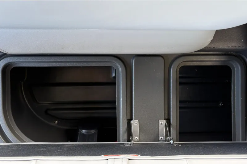 Slide: The Image of Storage compartments in 2026 Sun Tracker SportFish 22 DLX boat interior. - 31