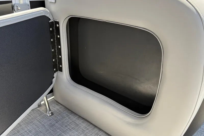 Slide: The Image of Storage compartment in 2026 Sun Tracker SportFish 22 DLX boat, featuring sleek design and durable materials. - 26