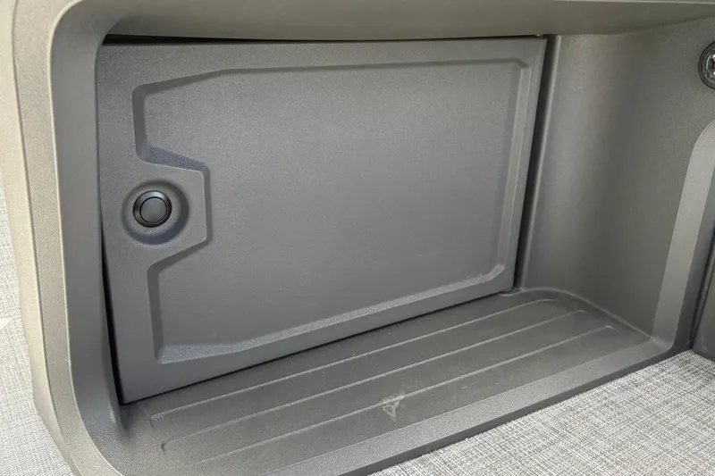 Slide: The Image of Storage compartment of 2026 Sun Tracker SportFish 22 DLX boat, featuring a sleek design. - 34