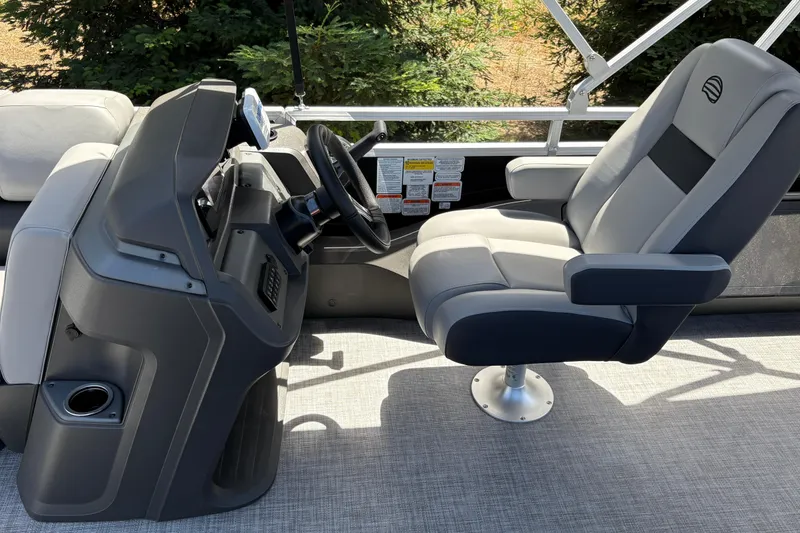 Slide: The Image of Captain's chair and console of 2026 Sun Tracker SportFish 22 DLX pontoon boat. - 10