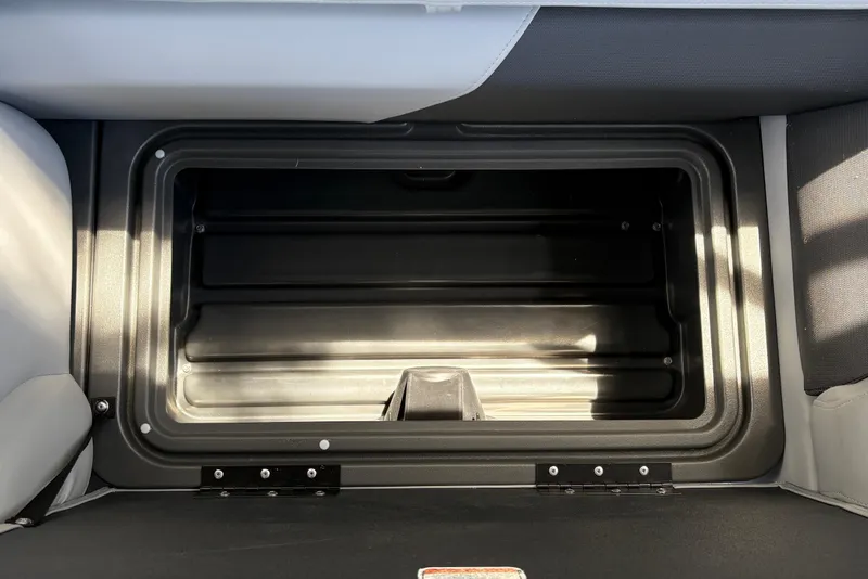 Slide: The Image of Storage compartment in 2026 Sun Tracker SportFish 22 DLX boat, featuring sleek interior design. - 30