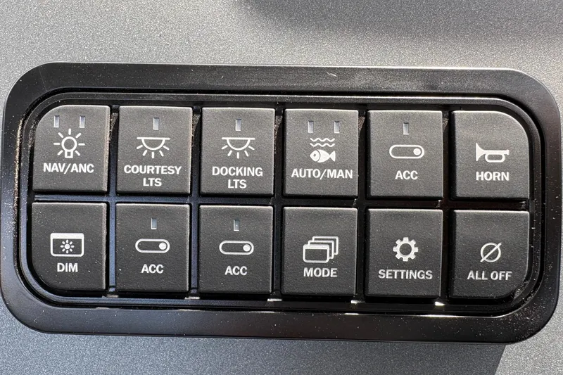 Slide: The Image of Control panel of a 2026 Sun Tracker SportFish 22 DLX with various function buttons. - 32