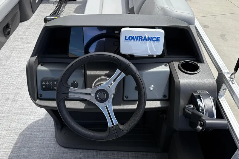 Slide: The Image of Steering console of 2026 Sun Tracker SportFish 22 DLX with Lowrance display. - 14