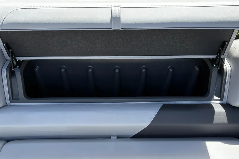 Slide: The Image of Open storage compartment in 2026 Sun Tracker SportFish 22 DLX boat seat. - 19