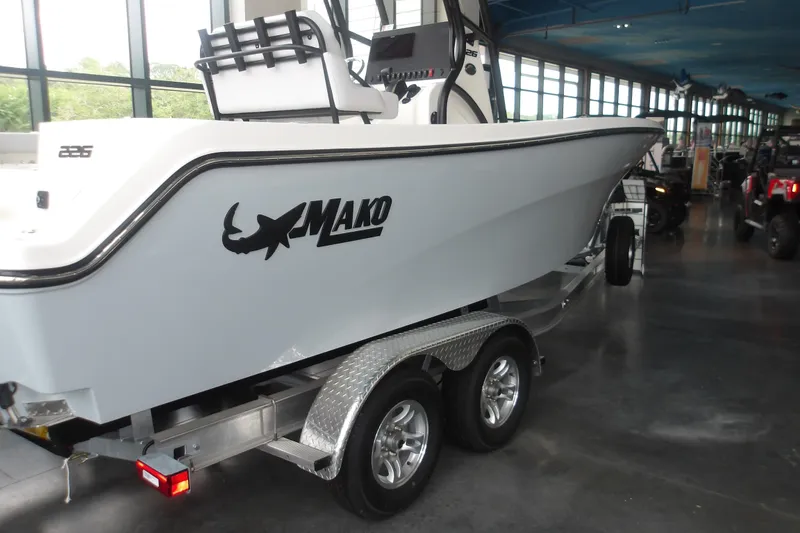 Slide: The Image of 2026 Mako 226 Center Console boat on trailer in showroom. - 36