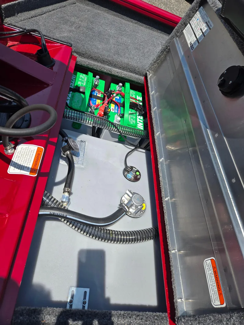 Slide: The Image of Battery compartment of the 2025 Tracker Pro Team 190 boat model. - 14