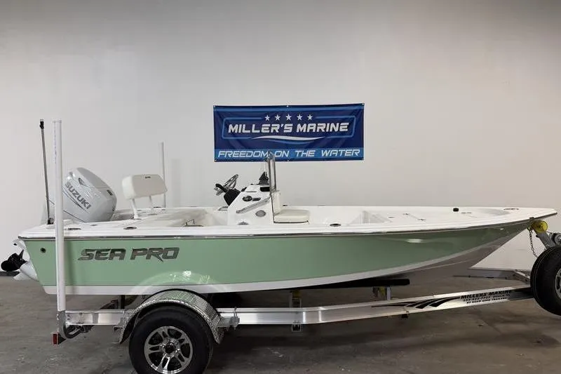 The Image of 2026 Sea Pro 172 Bay boat on trailer at Miller's Marine showroom. - 0