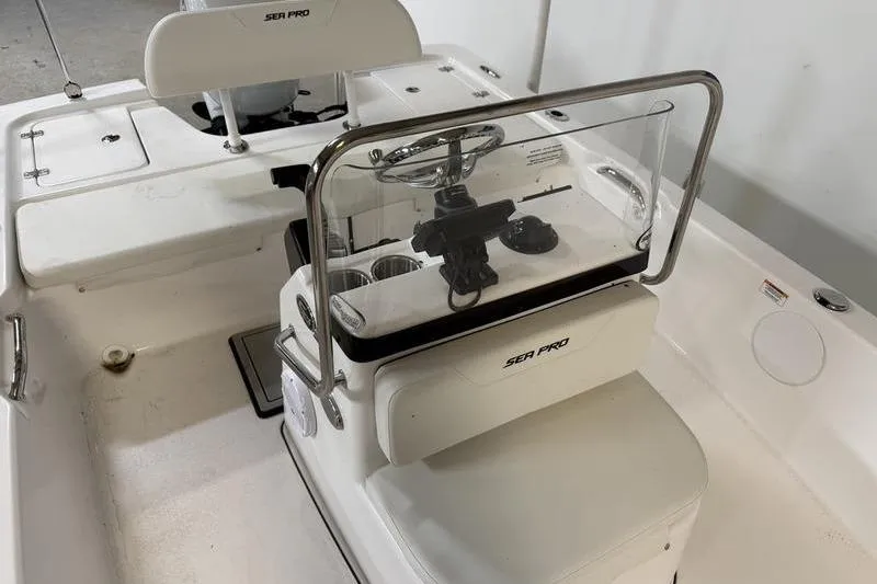 Slide: The Image of 2026 Sea Pro 172 Bay boat interior with steering console and seating. - 10
