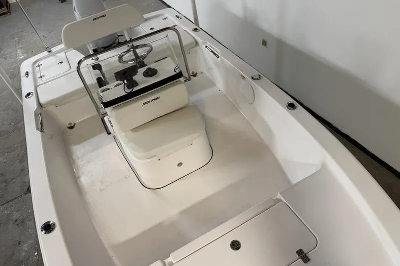Slide: The Image of 2026 Sea Pro 172 Bay boat interior with steering console and seating. - 11