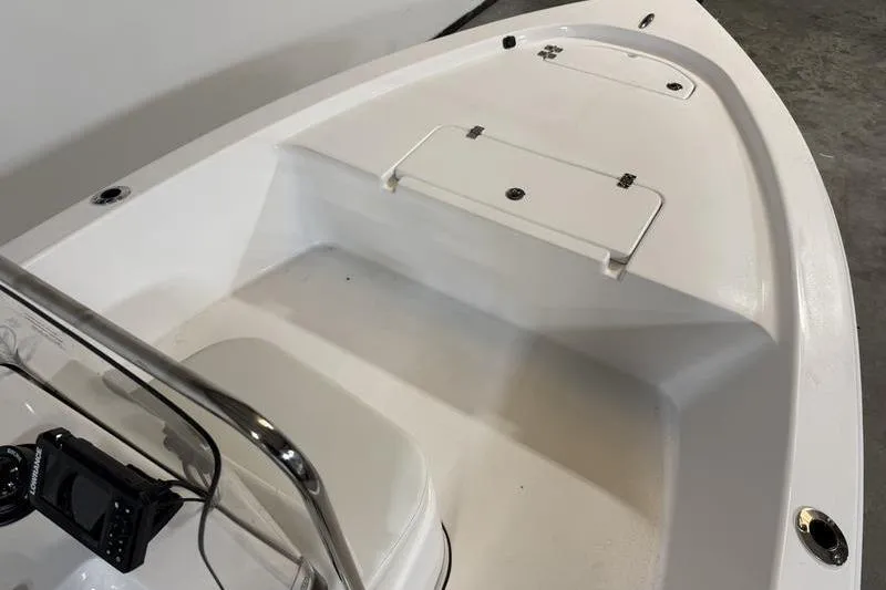 Slide: The Image of 2026 Sea Pro 172 Bay boat interior with storage compartments and control panel. - 12