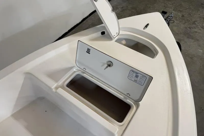 Slide: The Image of 2026 Sea Pro 172 Bay boat storage compartment with open hatch, showcasing interior space. - 13