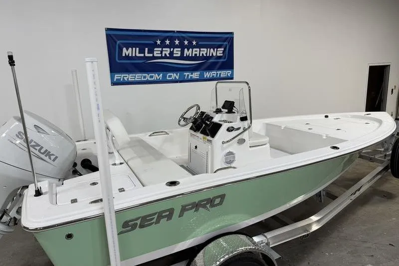 Slide: The Image of 2026 Sea Pro 172 Bay boat in showroom, featuring Suzuki engine and Miller's Marine banner. - 3