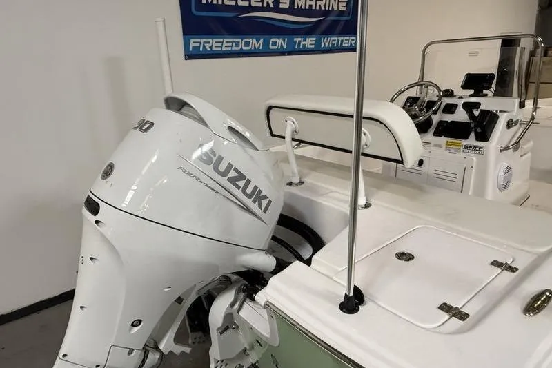 Slide: The Image of 2026 Sea Pro 172 Bay boat with Suzuki outboard motor in showroom. - 5