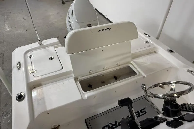 Slide: The Image of 2026 Sea Pro 172 Bay boat interior with steering wheel and storage compartments. - 7