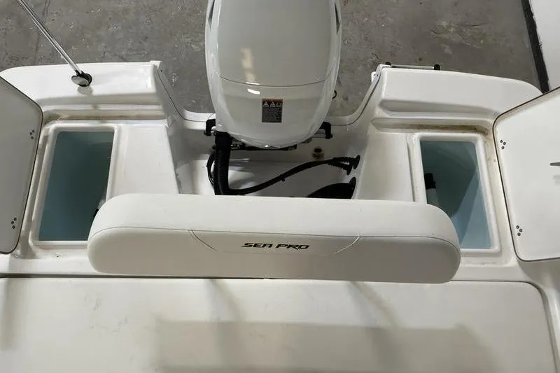 Slide: The Image of 2026 Sea Pro 172 Bay boat interior with motor and storage compartments. - 8