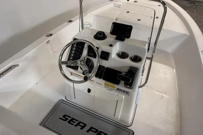 Slide: The Image of 2026 Sea Pro 172 Bay boat console with steering wheel and controls. - 9