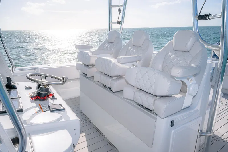 Slide: The Image of Luxurious 2020 Contender 44 ST boat interior with plush white seating and ocean view. - 12