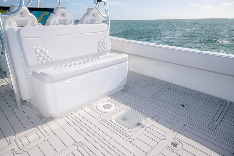 Slide: The Image of 2020 Contender 44 ST boat interior with white seating and ocean view. - 14